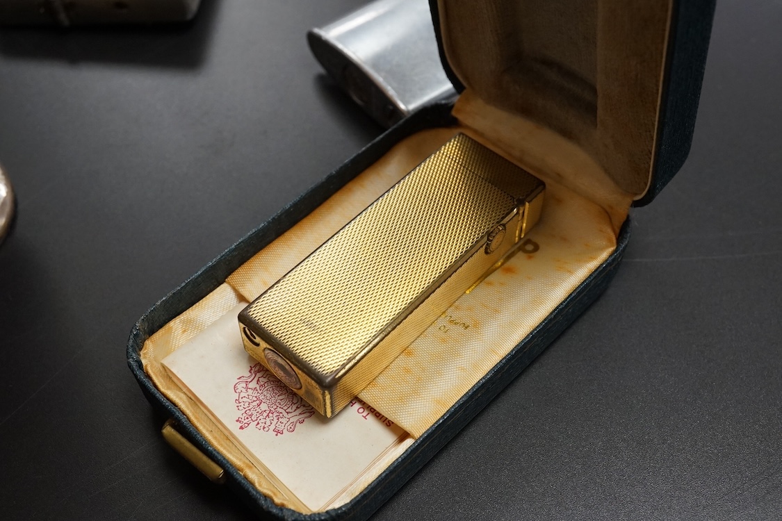 Ten assorted lighters including two Dunhill examples, a Ronson and Dupont, largest 12cm high